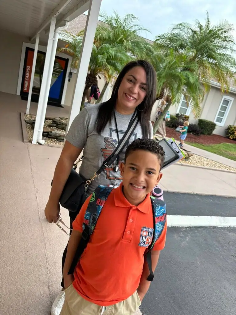 Mother and son smiling outside Bethany Christian School on the first day