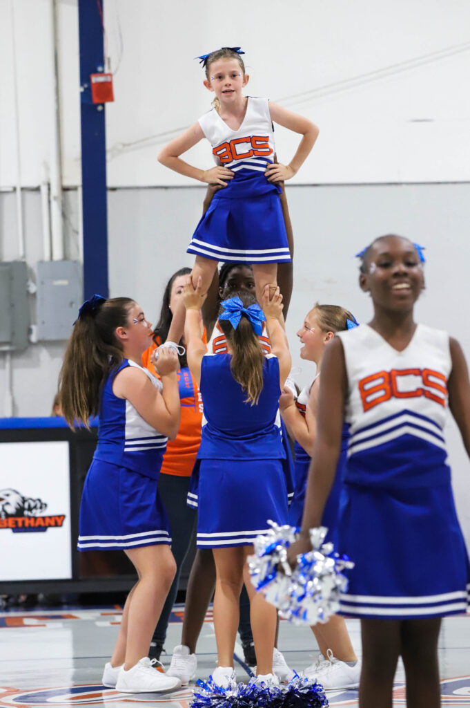 Bethany Christian School elementary cheerleaders performing a routine in the gym