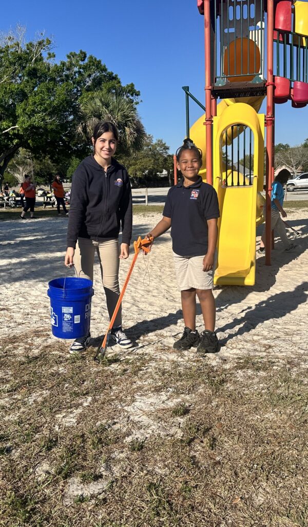 Elementary students participating in a campus cleanup project at Bethany Christian School.