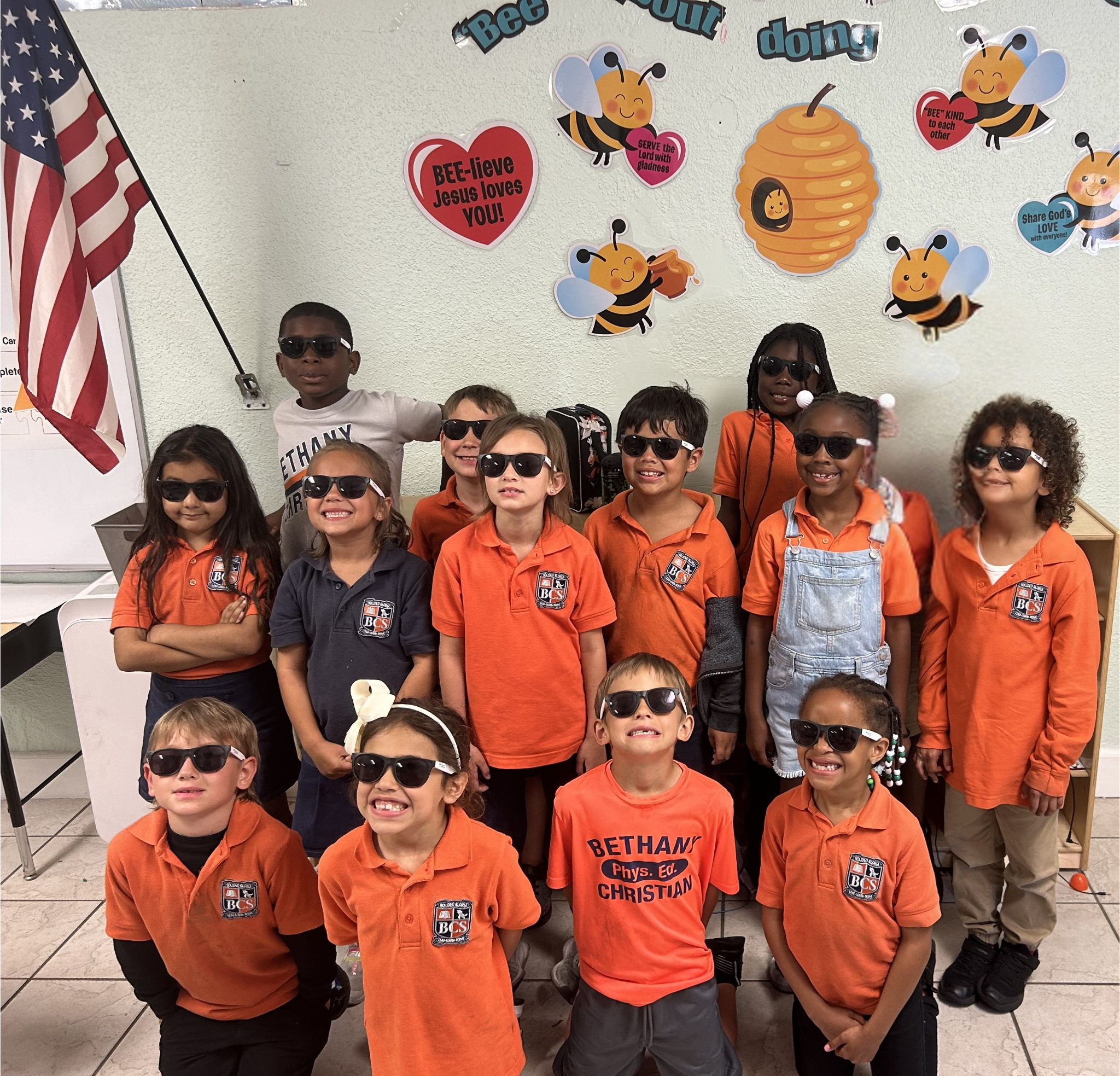Bethany Christian School elementary students smiling together during classroom activity, building a joyful and nurturing school community.
