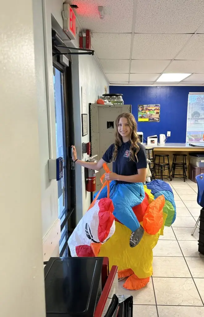 Bethany Christian School high school student wearing a colorful inflatable costume on Spirit Day.