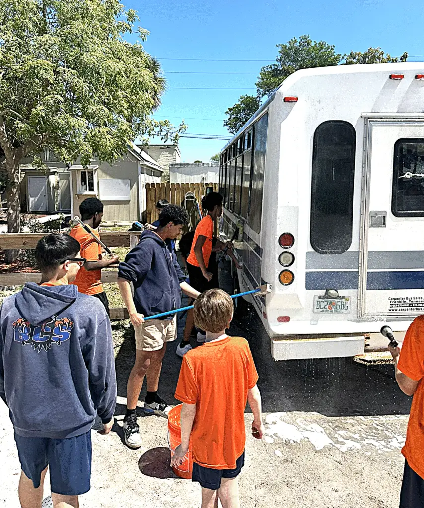 Bethany Christian School middle school students working together on a service project, developing leadership through teamwork and servant-hearted responsibility.